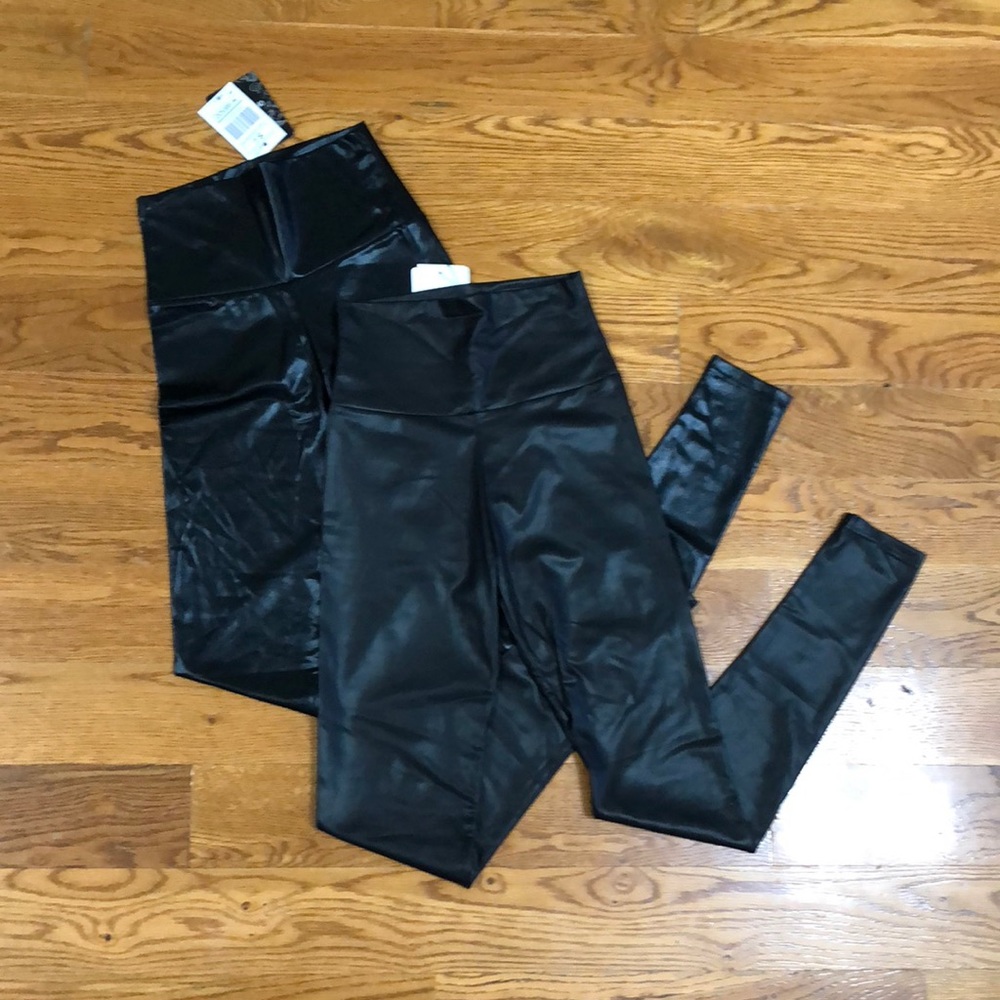 2 Black faux leather leggings. Size Small.